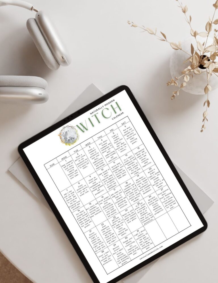 Modern witch Calendar digital on a tablet laying on a white table teaching witchcraft for beginners